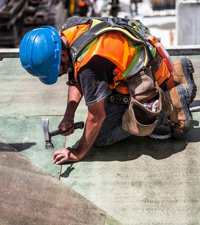 man working on roof